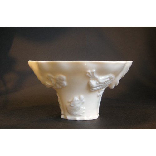 White porcelain libation blanc de Chine porcelain cup in the shape of rhinoceros horn